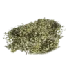 Pile of dried green herbs with yellow specks