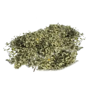 Pile of dried green herbs with yellow specks